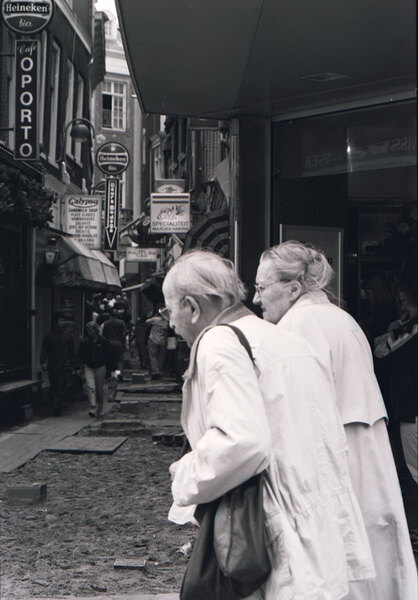 If this doesn't explain what a lifetime together represents, I don't know 
what does. Thanks to the Amsterdam light, which was kind enough on this 
occasion to light exactly half the street, I was able to capture an image
that remains one of my favourites.
I had spent a week in Amsterdam, and filled 8 or so rolls of film with 
images that I knew were second rate. On my last full day there, in the
course of a few hours, I got five memorable shots on a single roll of film.
This is my favourite of the bunch.
