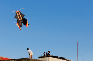 Roof-top kite flying is a popular pastime here in Bali. On any given day you can see dozens of them spotting the urban skyline.
