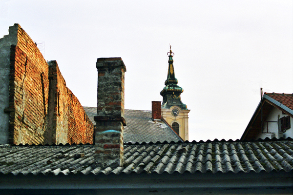 Zemun, once a separate village but now a suburb of Belgrade,
once marked the eastern edge of the Austro-Hungarian Empire.
As a result, it has a markedly more '<i>Mittel Europan</i>' 
feel to it than other neighbourhoods. This view across the
rooftops captures a little of its feel.
