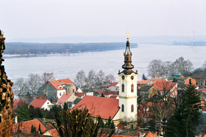 Zemun, once a separate village but now an suburb of Belgrade,
once marked the eastern edge of the Austro-Hungarian Empire.
As a result, it has a markedly more '<i>Mittel Europan</i>' 
feel to it than other neighbourhoods. This photo, taken from
the heights overlooking the town, shows the Danube river
in the background.

