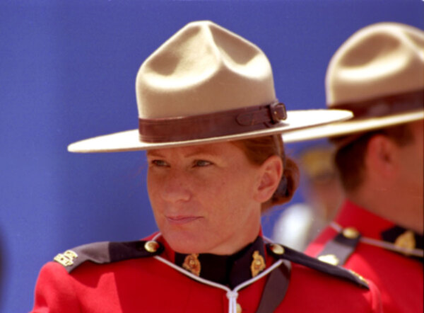 
Another postcard-type shot, this time of a woman Mountie. I took
this photo on my annual Canada Day walkabout in downtown Ottawa. 
Say what you like about a man in uniform, but...

