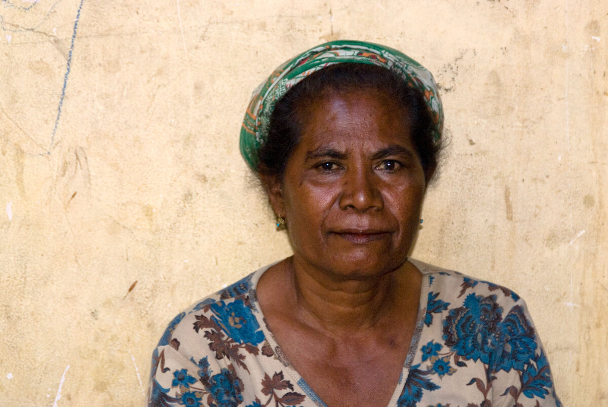 Over 40,000 people still occupy camps for Internally Displaced Persons in and around Dili, Timor-Leste. This woman was among hundreds who crowded a tiny yard, waiting to be processed by yet another humanitarian organisation.
