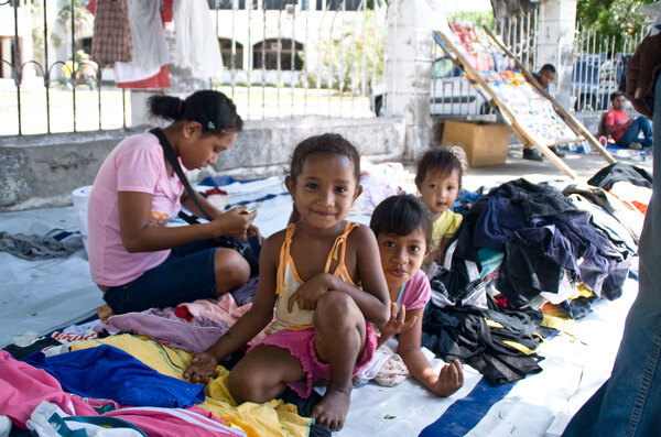 Children at one of Dili's many roadside markets.
