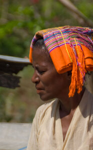 It's common to wear a cloth on top of one's head here. It offers protection from the brutally hot sun, and provides padding for one's burdens. Most women carry heavy loads on their head.
