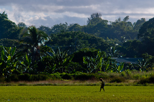 A boy walks home from Freswota school.
