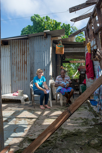 Wilma nurses her baby, Francois, in the middle of their family home on Ifira island. It is still in need of major renovations three months after cyclone Pam caused extensive damage.
