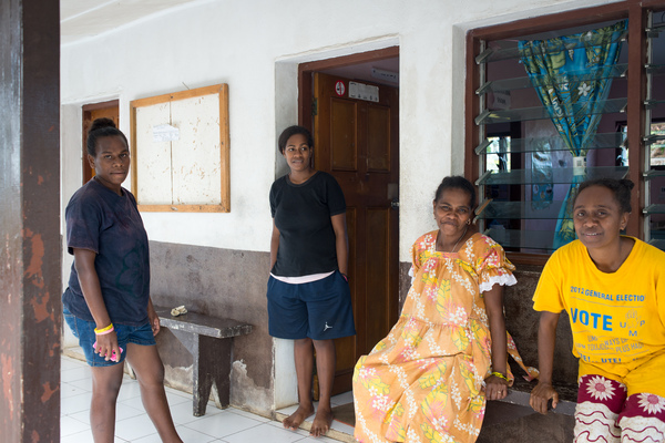Women gather at the entrance to the Ifira island community clinic.
