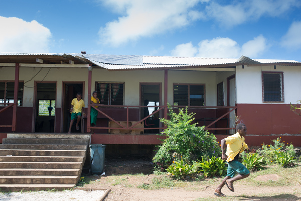 After cyclone Pam tore the roof off the English school on Ifira island, locals laid the corrugated sections back in place and covered the bare area with the tarpaulin. Three months later, no further repairs have been done.
