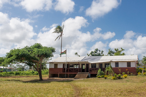 After cyclone Pam tore the roof off the English school on Ifira island, locals laid the corrugated sections back in place and covered the bare area with the tarpaulin. Three months later, no further repairs have been done.
