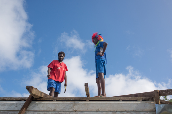 Members of Wilma's extended family at work renovating the family home on Ifira island.
