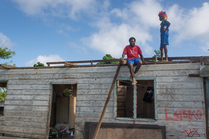 Members of Wilma's extended family at work renovating the family home on Ifira island.
