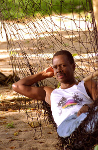 Kibwana is captured in his characteristic pose of deep thought as he 
considers the intricacies of teaching finance in the islands.
