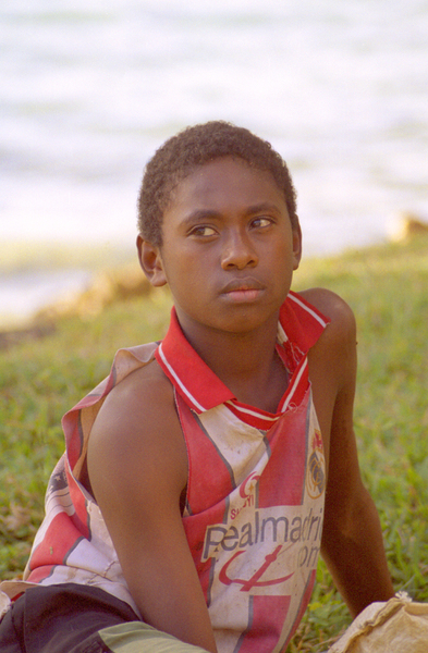 A young boy who came to see what the chief was doing,
leading a couple of white guys around the village.

