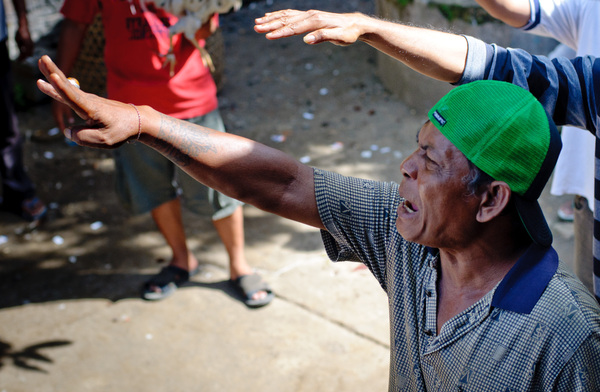 Scenes from a traditional cockfight in Mataram, Lombok, Indonesia.
