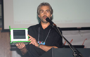 David Leeming introduces the XO laptop to PacINET attendees during a plenary
session.
David, along with the other members of the OLPC Oceania committee, has been
instrumental in building interest and support for this and other critical
improvements in communications in the Solomon Islands and throughout the 
Pacific Region.

