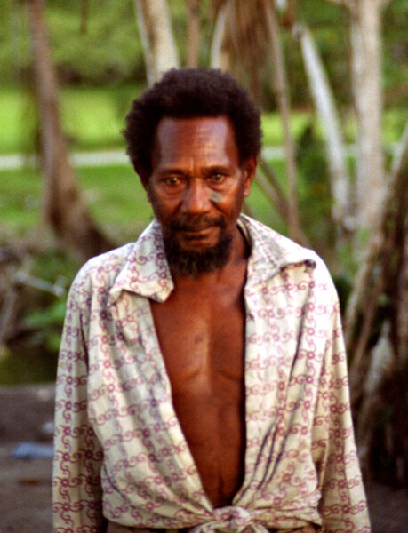 This man, a neighbour of ours while we stayed in Sola, was the creator of
one of the best-known landmarks in Vanuatu: An eight-foot tall pig's tusk
(for reference, <a href="http://www.janeresture.com/vanuatu_pictures/tNew%20Hebrides%20Vanuatu%20RARE%20PIG%20TUSK%20CURRENCY%20usk.jpg">here's a real one</a>)
that stands outside Pekoa airport on Espiritu Santo.
The tusk is a little amusing at first, until you consider how it was made.
By way of a hint, there aren't many facilities in Vanuatu to create, for 
example, fibreglas forms to mould the concrete. This man completed the task
without any tool more advanced than a machete.
He appears to be mentally impaired in some way, perhaps with some mild kind
of autism or Asperger's syndrome. He readily recognises and welcomes friends
and family members, but does not respond in any way to spoken or signed
language. He's a brilliant individual.

