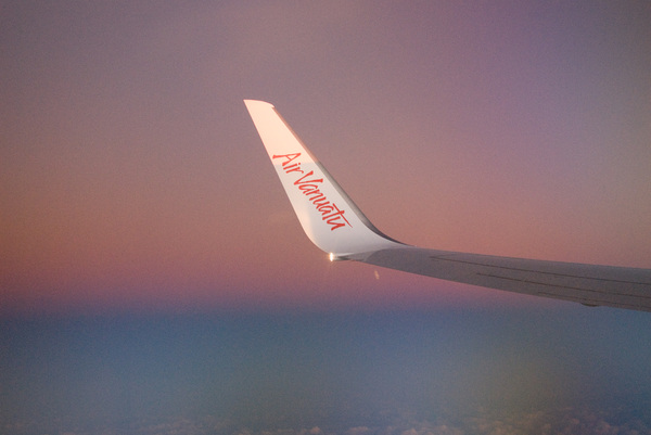 The wing of Air Vanuatu's 737 catches the last of the afternoon light.
