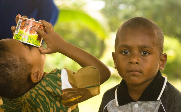 Two young boys waiting for the wedding ceremony to begin.
