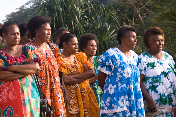 The women - or '<em>Mamas</em>' in local parlance - keep a close
eye on festivities as the kastom dancing gets going in
earnest.
Word to the wise: You can say sorry to a chief if you must.
It's hard work, but it can be done. But heaven help you if you 
cross "<em>wan blong ol mama</em>'.
