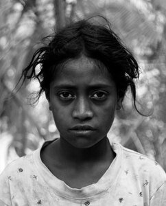 I was taking photos of some nearby caves when this young girl marched up and informed me that I had to take her photo. I'm glad I did. 
