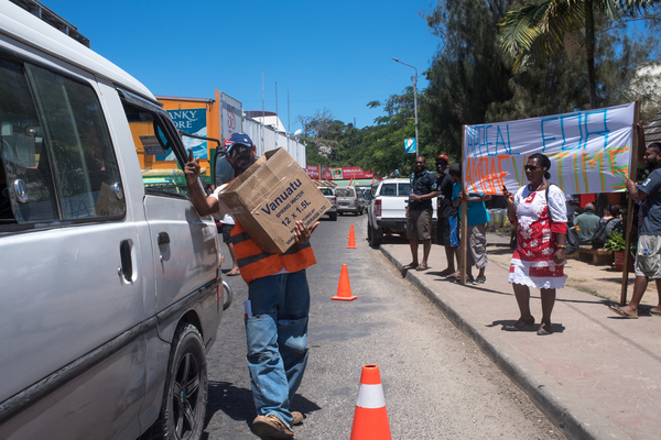 Volunteers conduct a roadside fund-raising activity in aid of evacuees from Ambae's volcano.
