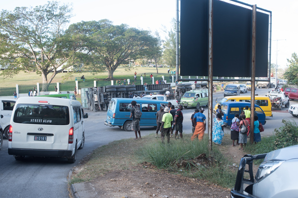 The driver of a container carrier was shaken but not seriously injured when his vehicle overturned at the USP roundabout. Traffic was snarled in all directions.
