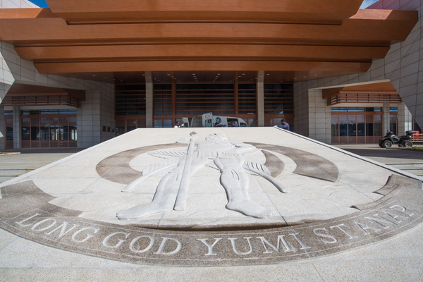 A bas-relief sculpture of the Vanuatu Coat of Arms and motto at the entrance to the new Convention centre.
