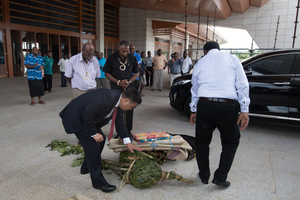 Chinese Ambassador Liu Quan and Vanuatu PM conduct a kastom ceremony, watched over by venerable chiefs.
