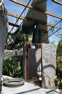 The partially destroyed roof of a resting area in a botanical garden near Port Vila.
