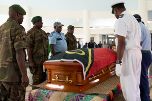 Edward Natapei's coffin is carried into parliament and laid out in the foyer.
