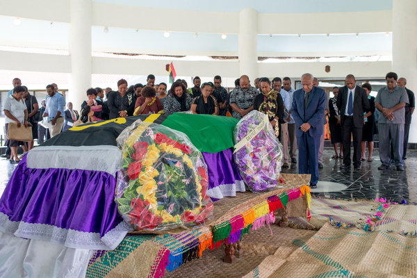 Prime Minister Sato Kilman pays his respects.
