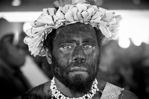 A Futunese warrior standing guard over the body of Edward Natapei, whose body lies in state at Parliament.
