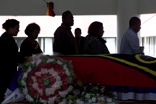 Mourners line up to pay their respects to the family.
