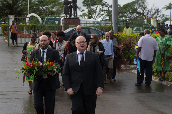 Australian High Commissioner Jeremy Bruer arrives at Parliament to pay his respects to Edward Natapei, whose body lies in state there.
