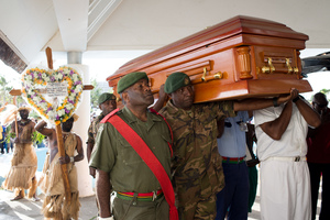 Edward Natapei's coffin is carried into parliament and laid out in the foyer.
