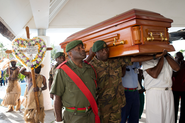 Edward Natapei's coffin is carried into parliament and laid out in the foyer.
