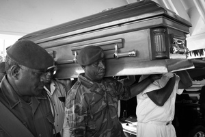 Edward Natapei's coffin is carried into parliament and laid out in the foyer.
