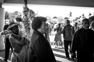 Mrs Natapei follows her husband's coffin into Parliament, where she and her family will accept condolences from the thousands of mourners who arrive to pay their respects.
