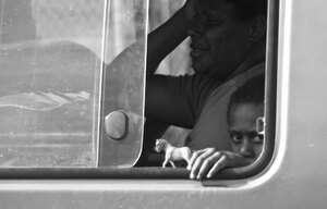 Playtime in transit on one of Port Vila's countless buses.
