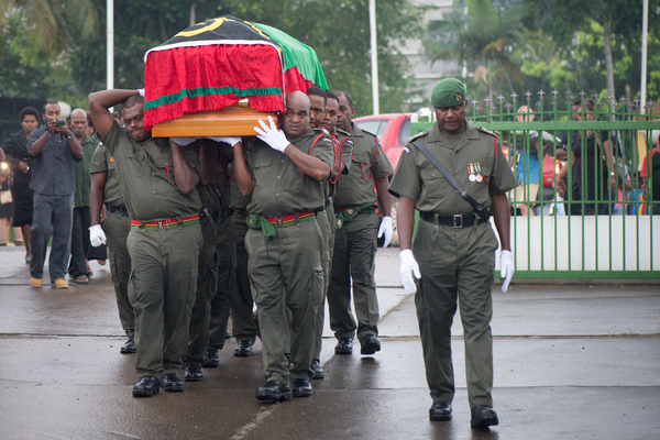 The body of President Baldwin Lonsdale is carried into Parliament by a Vanuato Mobile Force honour guard.
