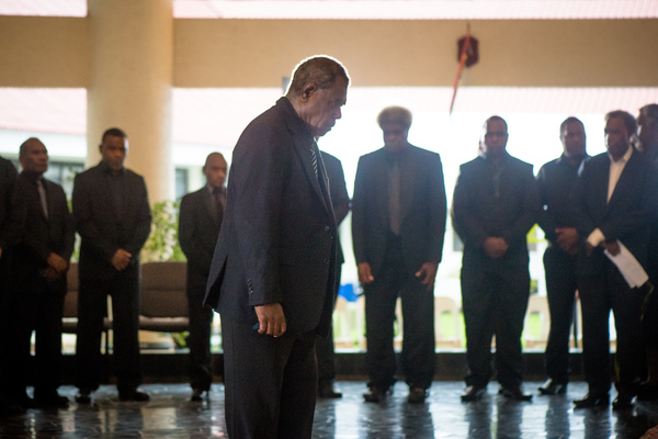 Speaker and Acting Head of State Esmon Saimon bows before the body of President Baldwin Lonsdale.
