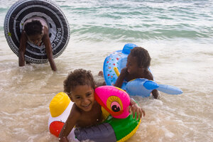 Small Jacob and the others tumble about in the surf at Honeymoon
Beach.
