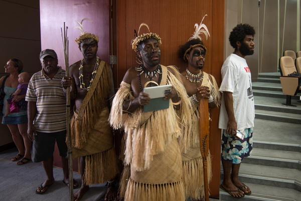 Old meets new: A Futunese Kastom Dancer records a speech by prime minister Charlot Salwai on on tablet during the opening ceremony of ICT Days in Port Vila.
