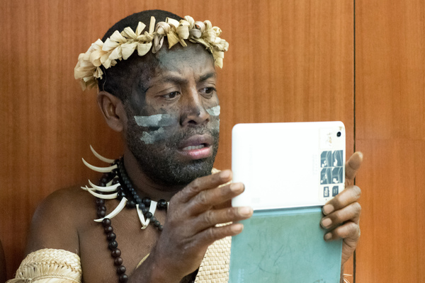 Old meets new: A Futunese Kastom Dancer records a speech by prime minister Charlot Salwai on on tablet during the opening ceremony of ICT Days in Port Vila.
