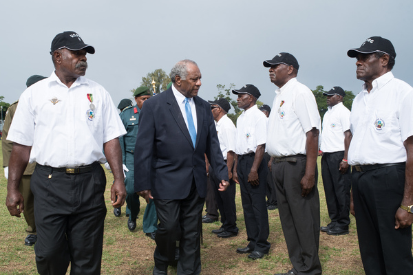 President Lonsdale inspects a contingent of retired colonial police officers.
