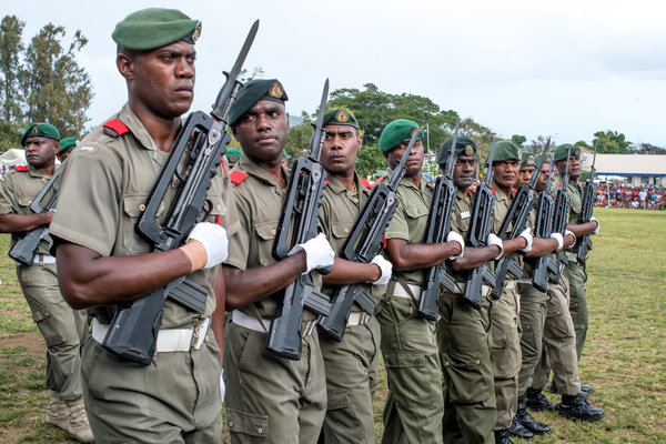 Vanuatu Mobile Force members turn eyes right as they march past the reviewing stand.
