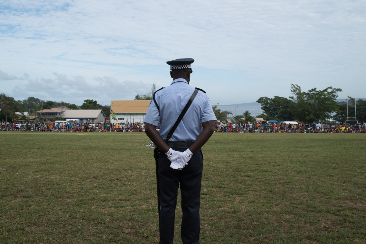 A policeman stands by as the crowd gathers to celebrate at Independence Park.
