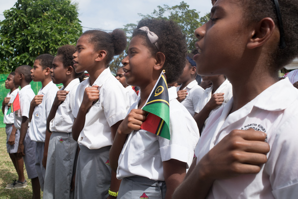 A children's choir sings the national anthem at the President's annual cocktail party.
