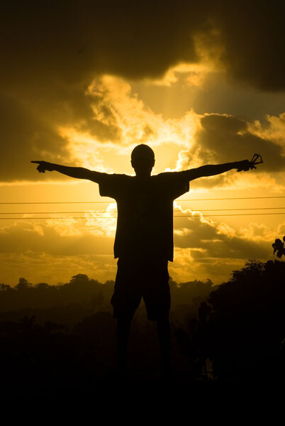 I was taking photos of the sunset when Kal leapt up onto the
wall across the road and struck this pose.
