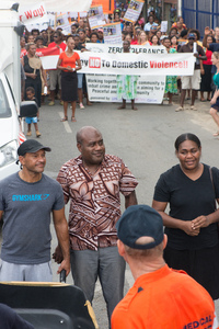 Justice Minister Ronald Warsal took his place at the head of a march to end violence against women.
